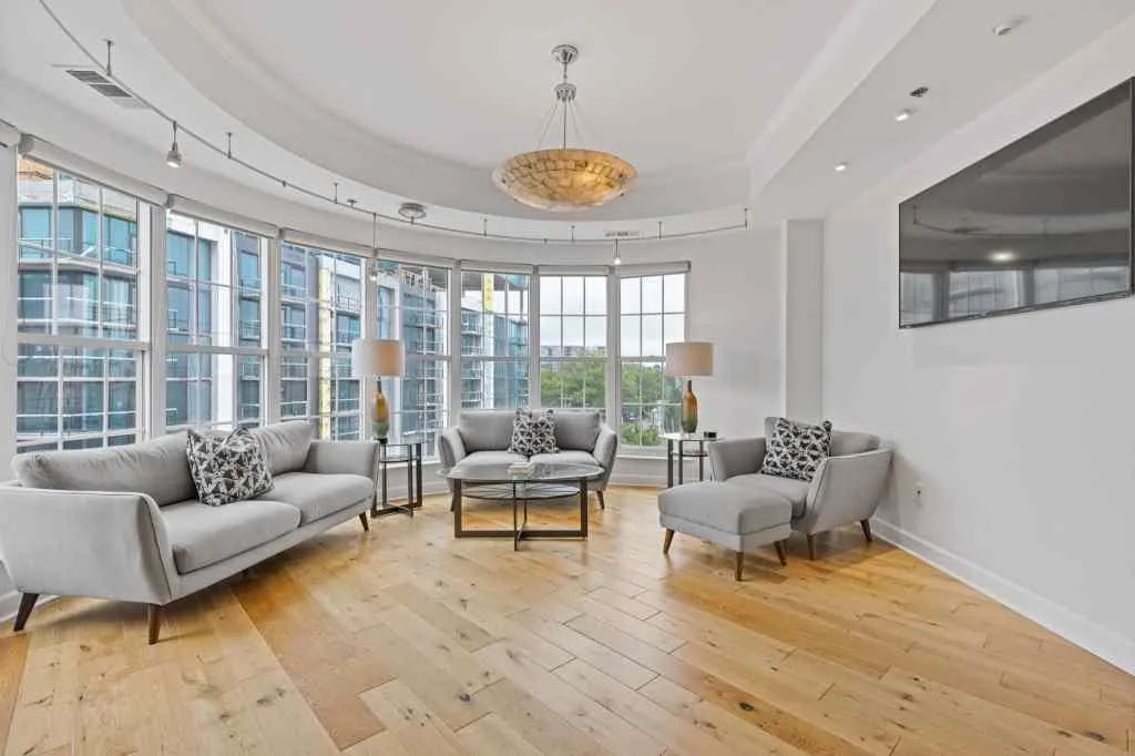 This living space is the perfect city living space.  The wall of windows is the perfect accent to this room.