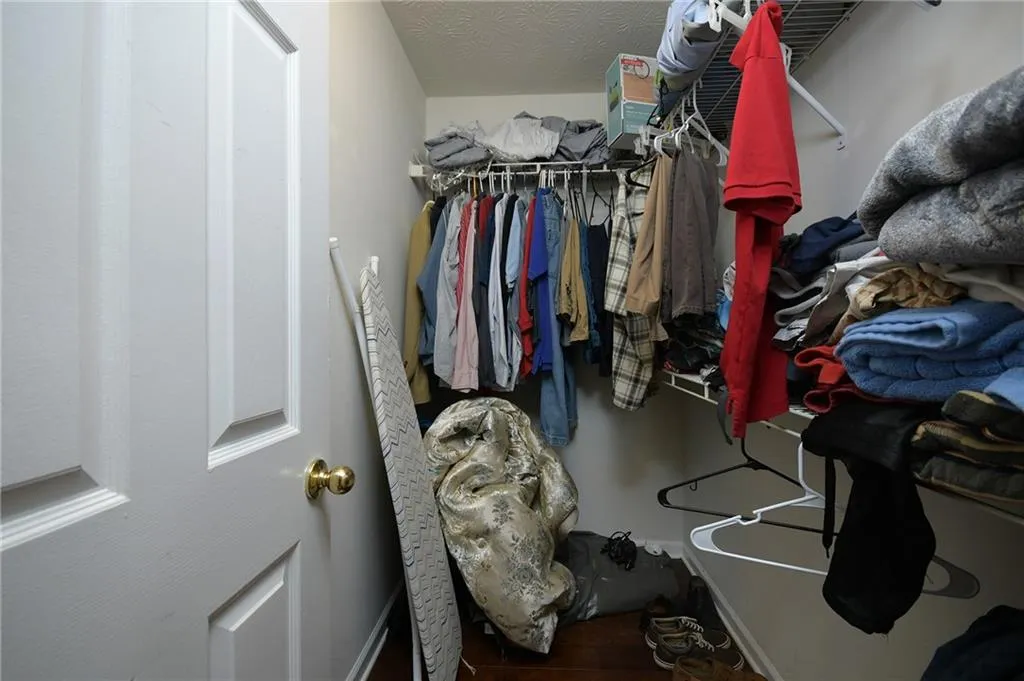 Spacious closet featuring wood finished floors