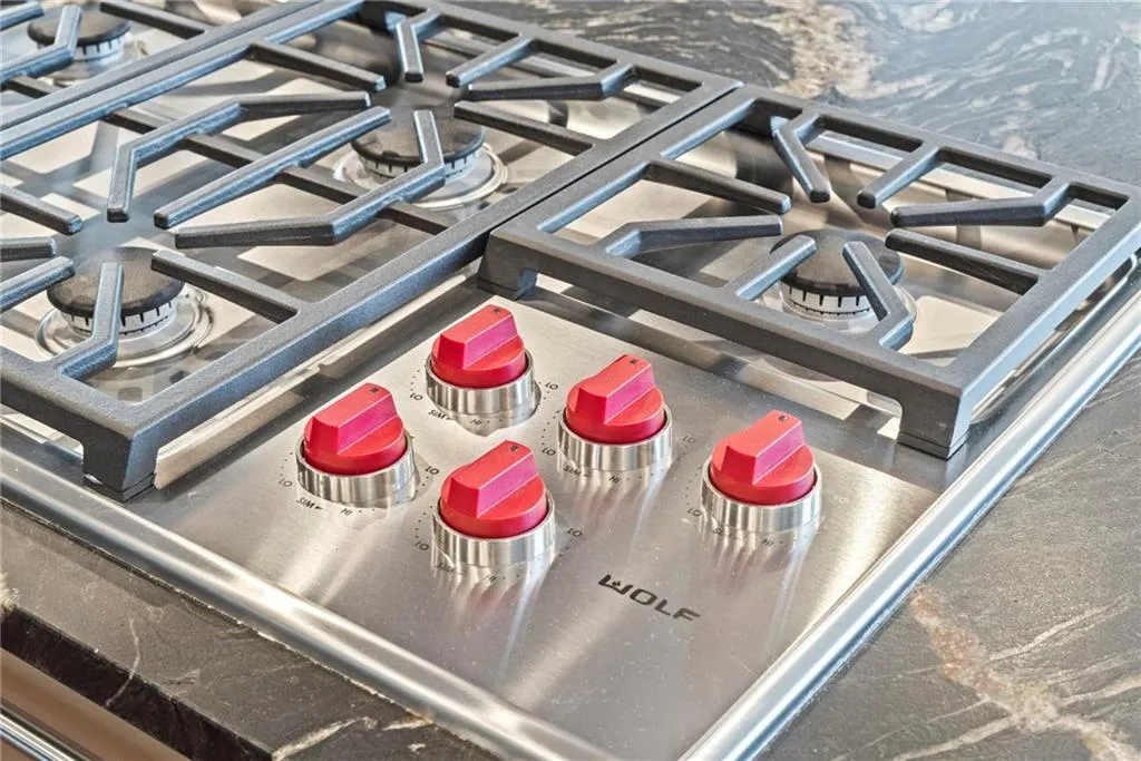 Wolf cooktop - gas cooking with custom vent hood - exhausts outdoors!