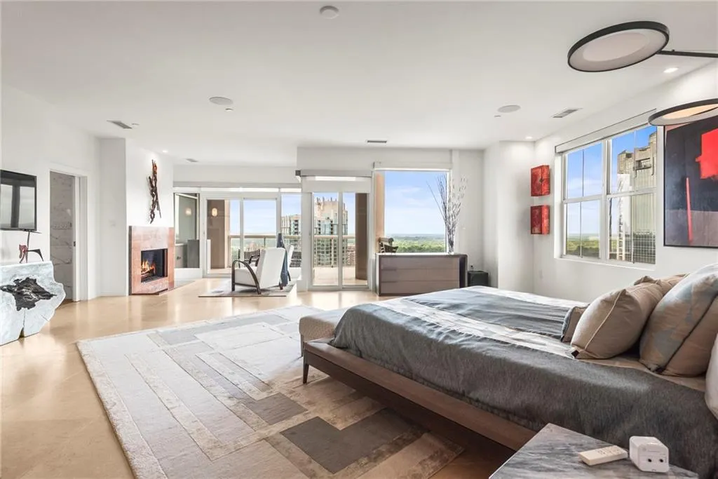 Looking into the sitting room with yet another fireplace and balcony!