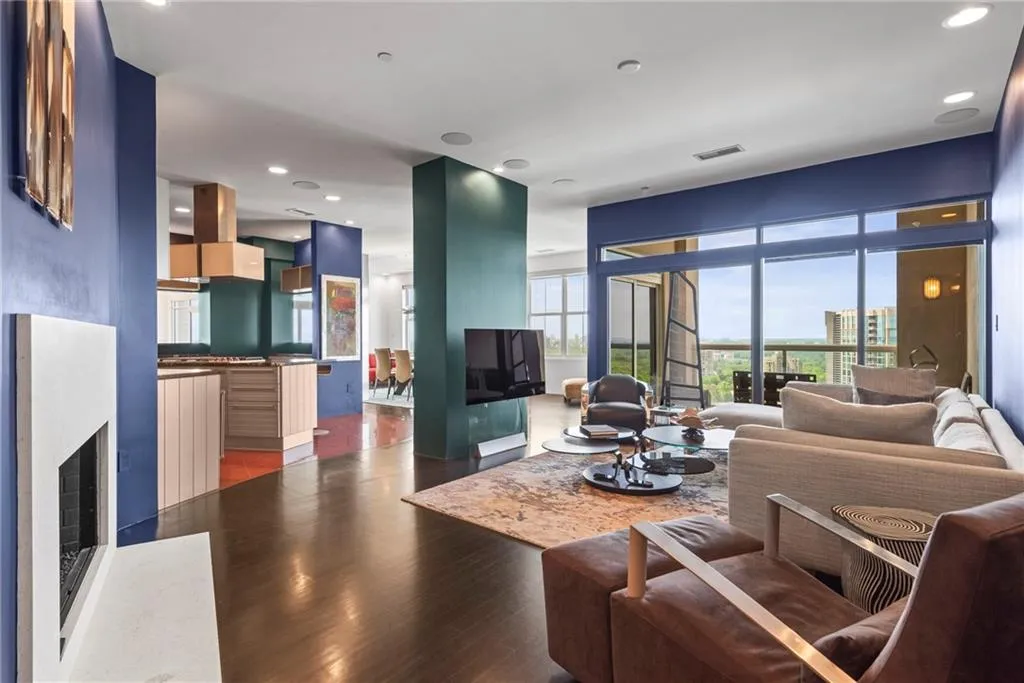 Looking from the Den into the kitchen - fireplace & balcony!