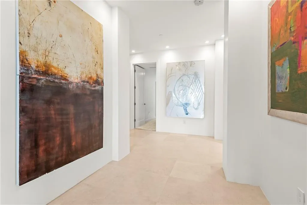 Contemporary Space has lots of great lighting and stone floors