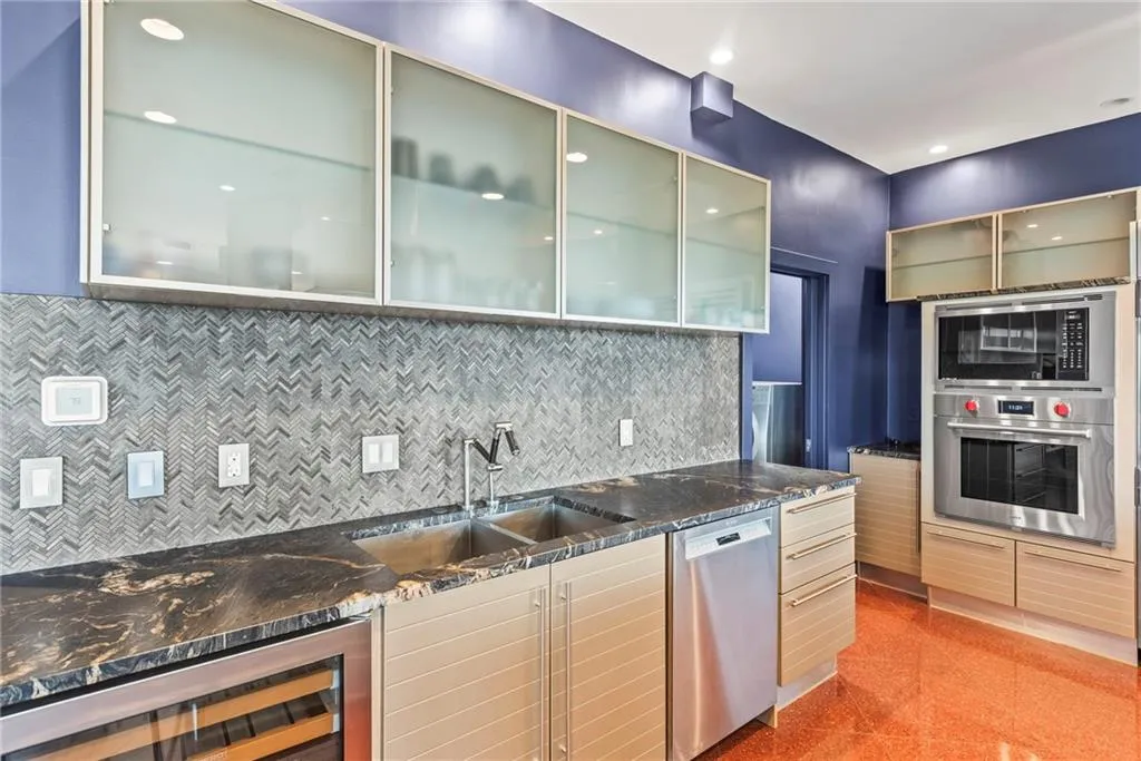 Contemporary kitchen provides storage and state-of-the-art appliances