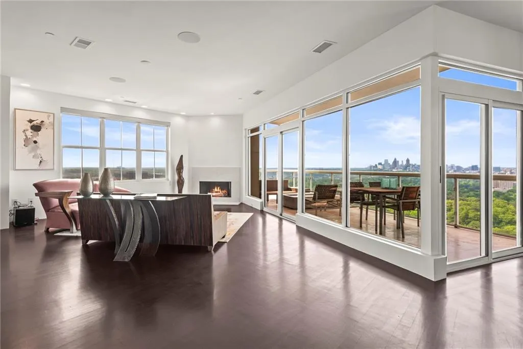 Wide Open space with one of the THREE FIREPLACES in this Modern condo!