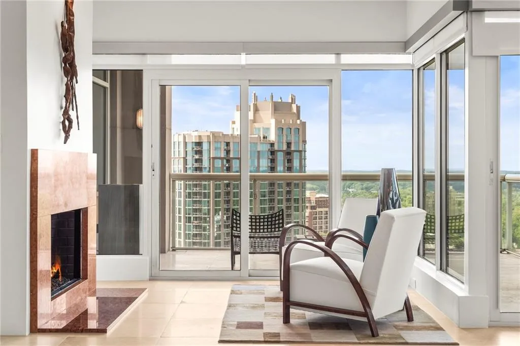 Sitting room within primary has fireplace, private balcony & great views!