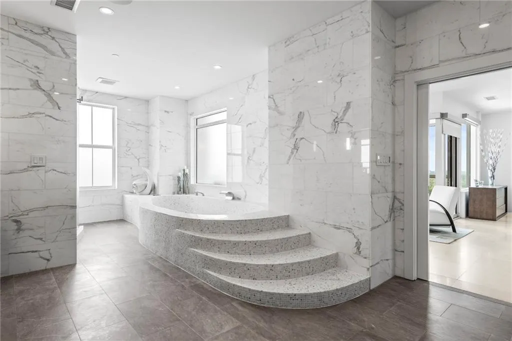Spa-like walk in tub with marble walls - frosted privacy window