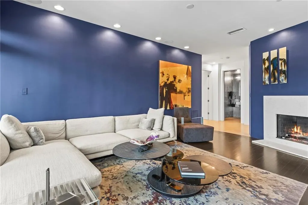 Modern Den is ideal for watching tv or enjoying one of the THREE fireplaces!  Cozy....