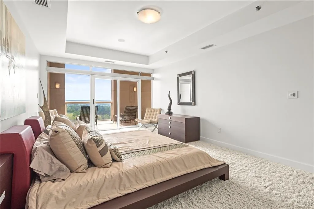 Large tray ceiling adds additional volume to this oversized guest suite