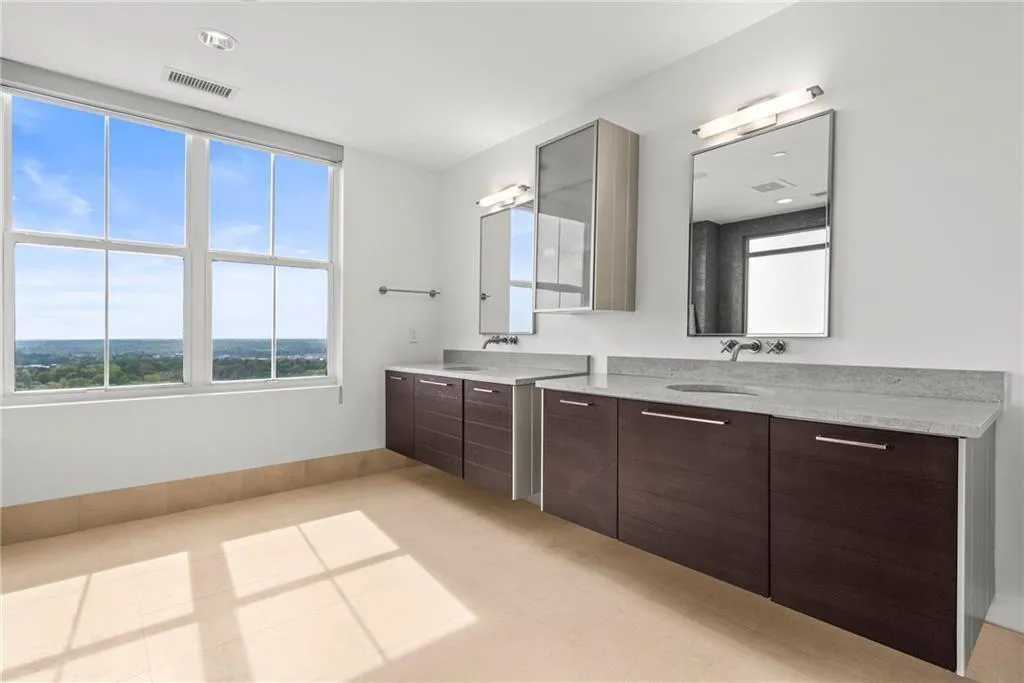 Modern double vanities and faucets. Stone counter tops