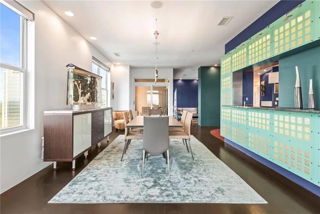 Backlit dividing wall between kitchen and dining room adds contemporary ambiance!