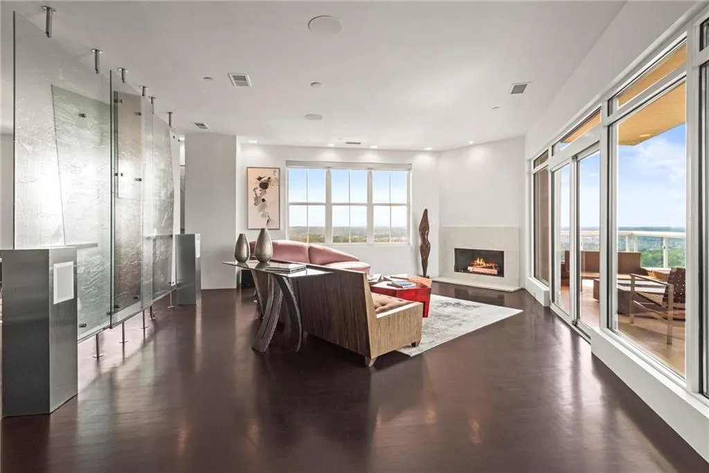 Chic and modern art glass divider separates yet leaves this massive space wide open!