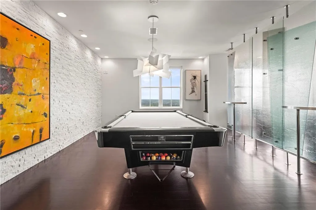 Custom frosted glass divider creates a special space for a music or pool room!