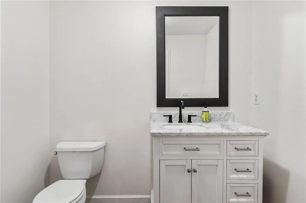 Bathroom featuring vanity and toilet