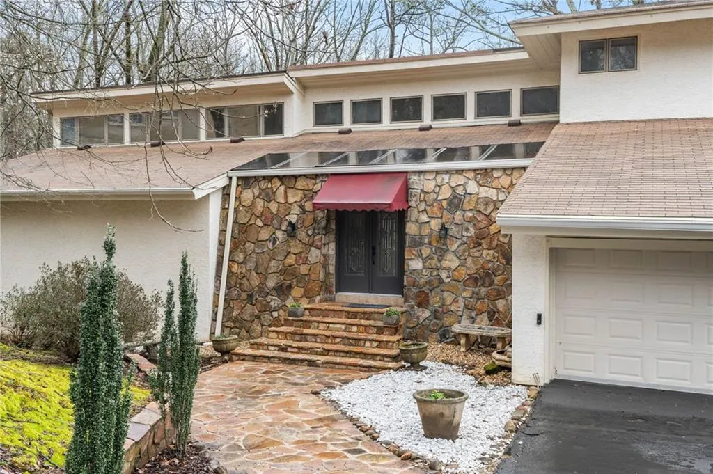 View of front of property featuring a garage