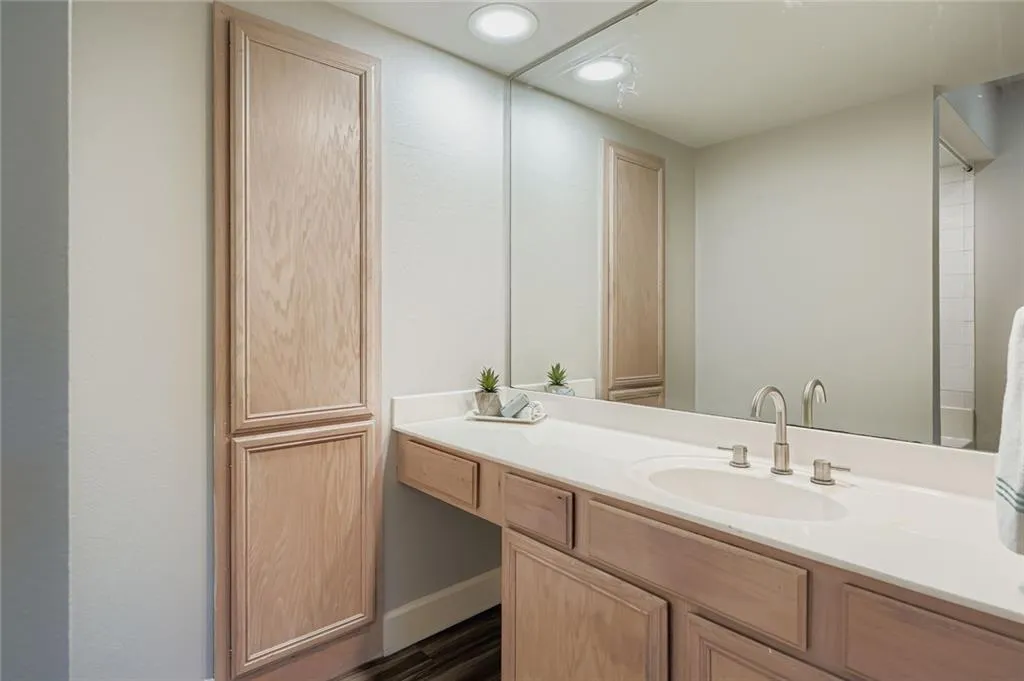 Bathroom featuring vanity and recessed lighting