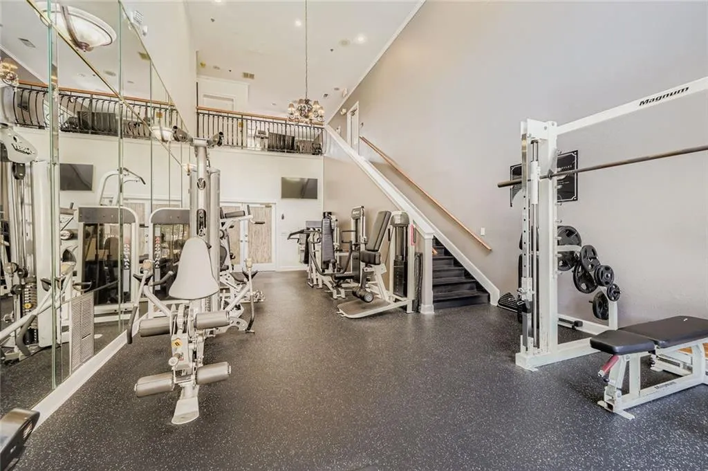Workout area featuring a high ceiling