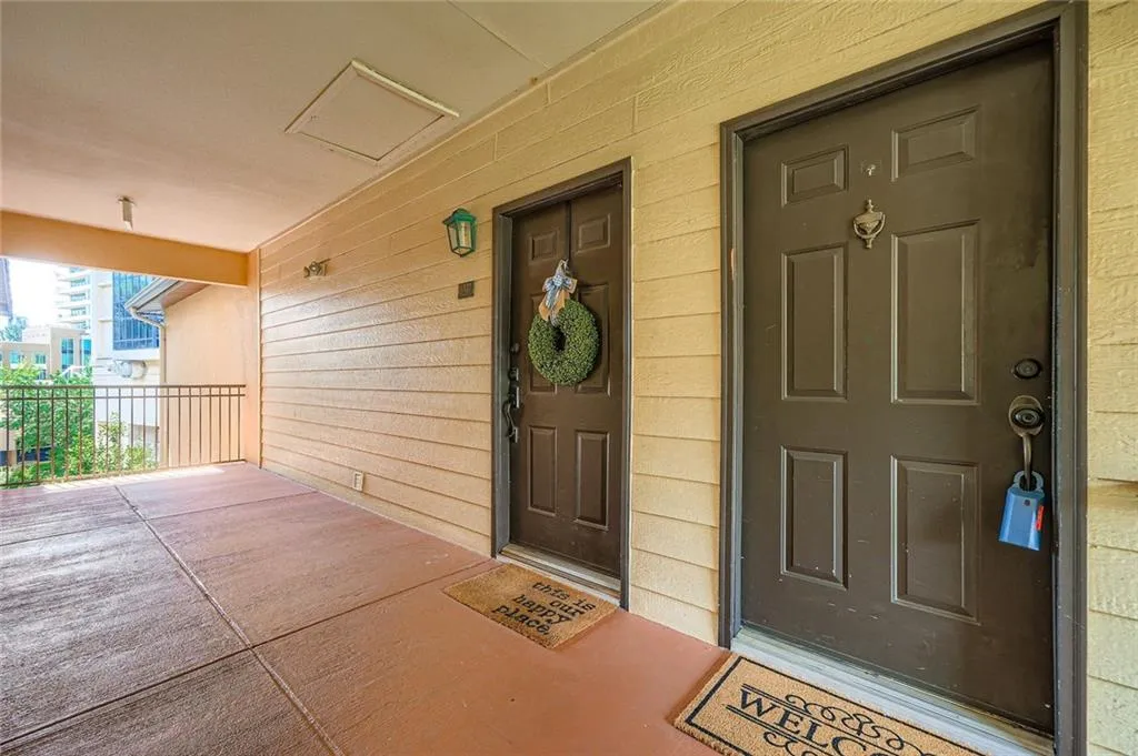 Doorway to property with covered porch