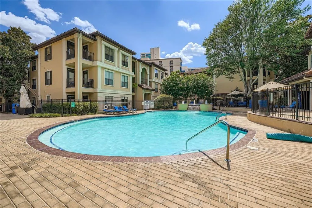 Community pool featuring a patio