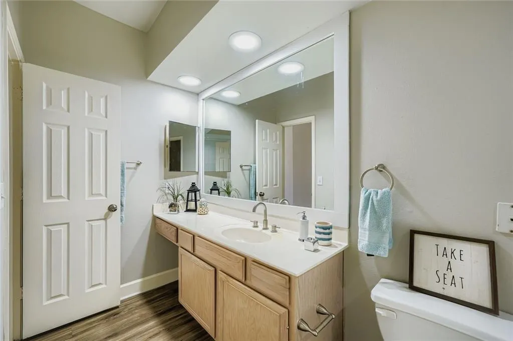 Bathroom featuring vanity and wood finished floors