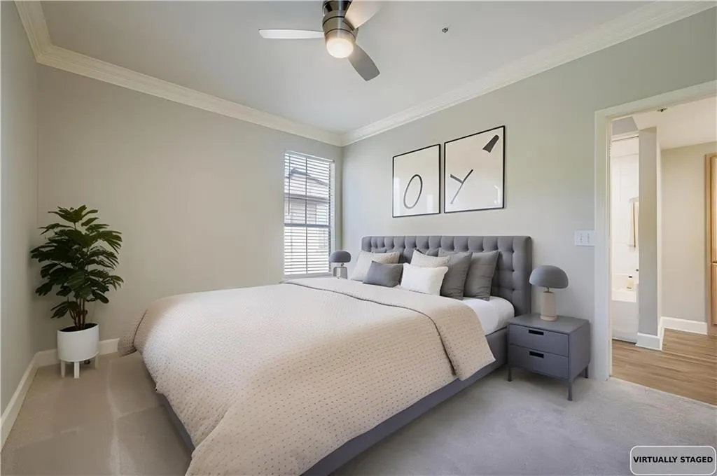 Bedroom with crown molding and ceiling fan