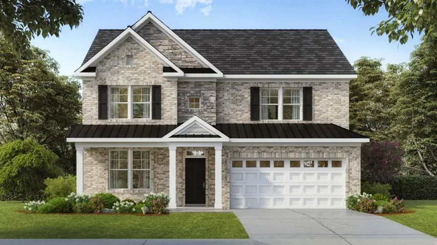 Two-story residence featuring a brick and stone exterior, a two-car garage, and a covered front entry