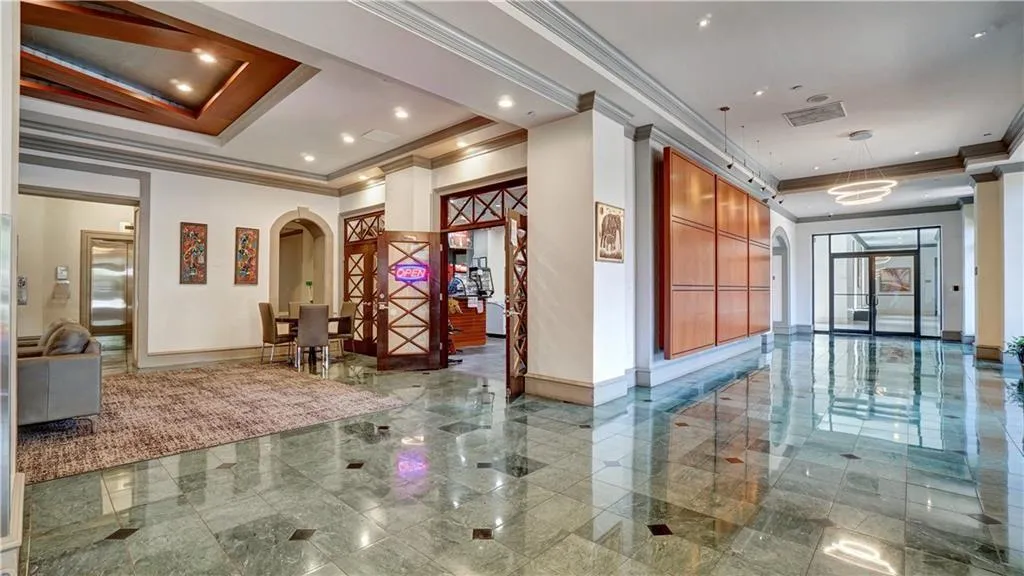Building lobby with crown molding and recessed lighting