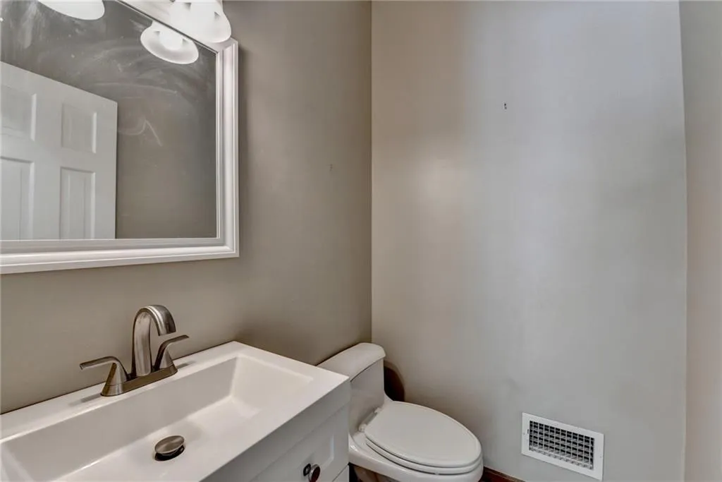 Bathroom featuring toilet and vanity