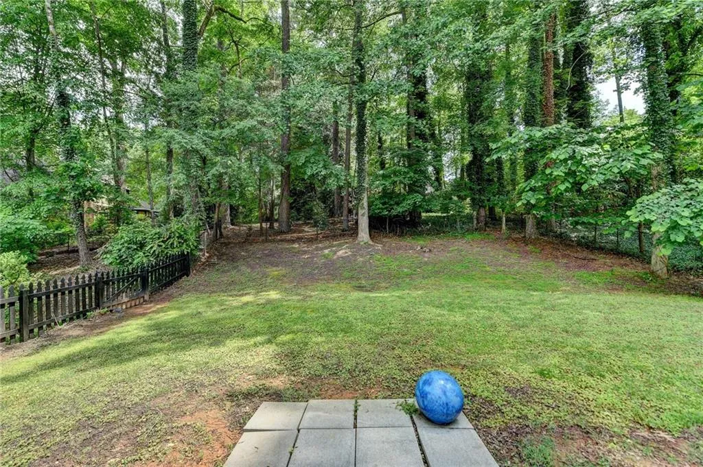 View of yard featuring a forest view