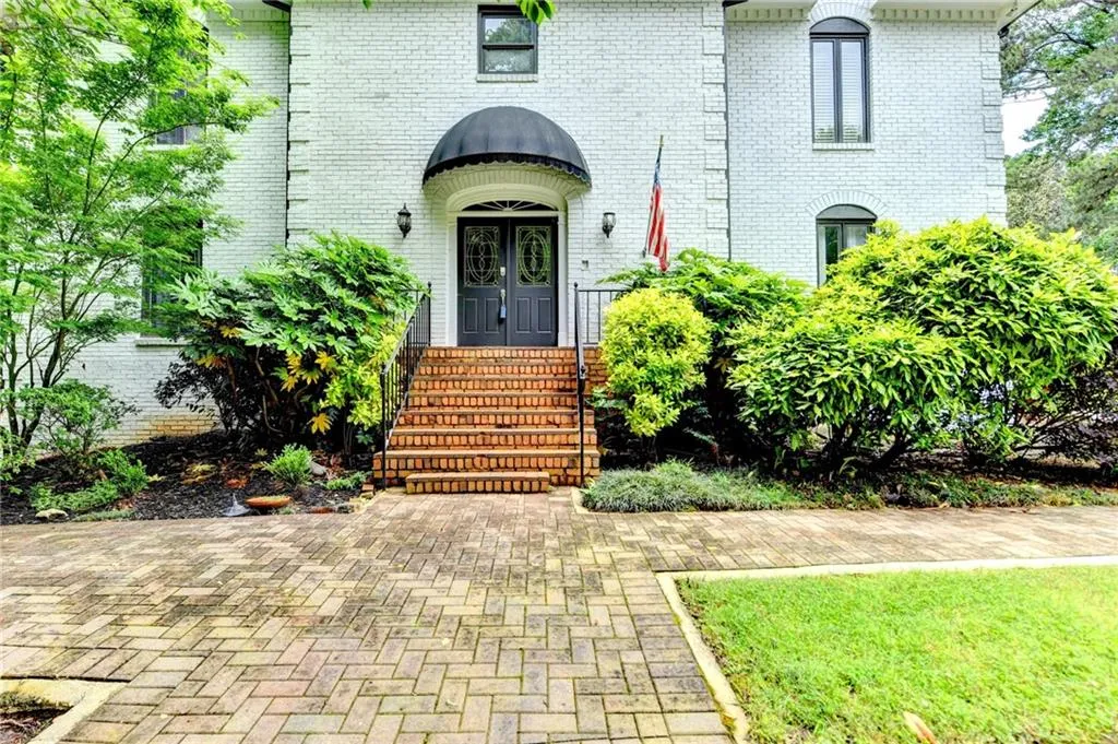 Entrance to property with french doors and brick siding