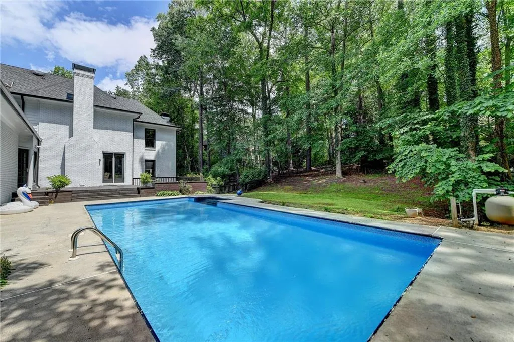 Outdoor pool with a patio area