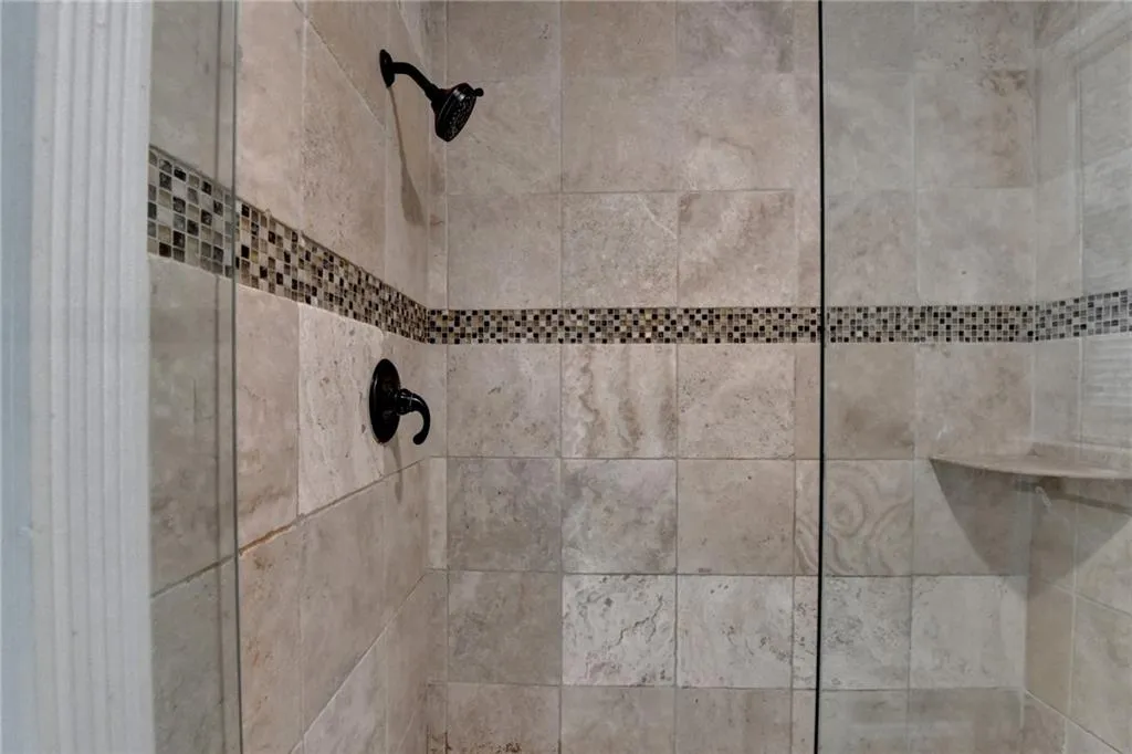 Bathroom view of a tile shower