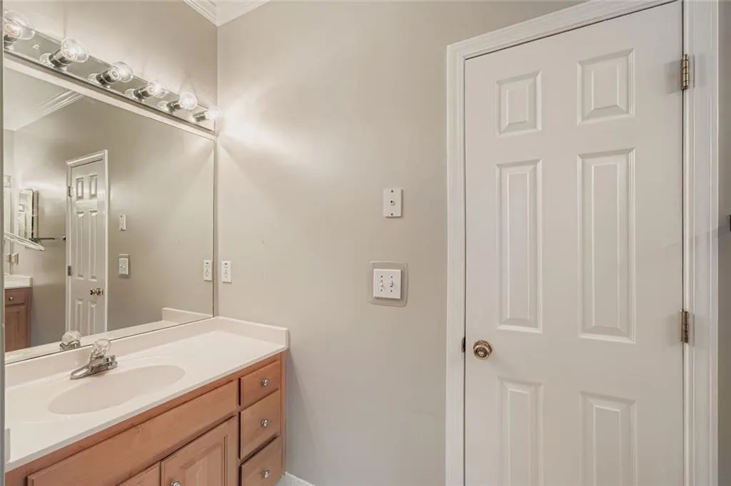 Bathroom featuring vanity and ornamental molding