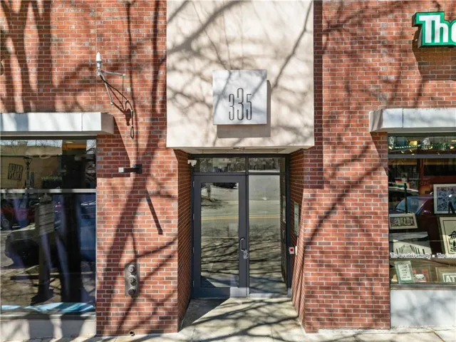 Doorway to property with brick siding