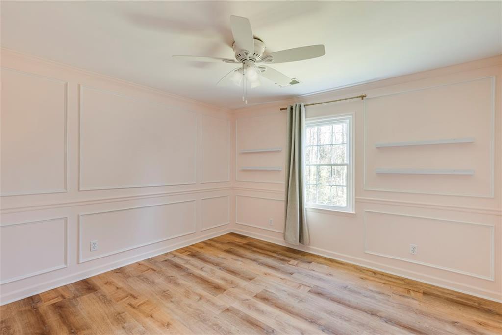 Custom wall molding in this living room/office with French Doors