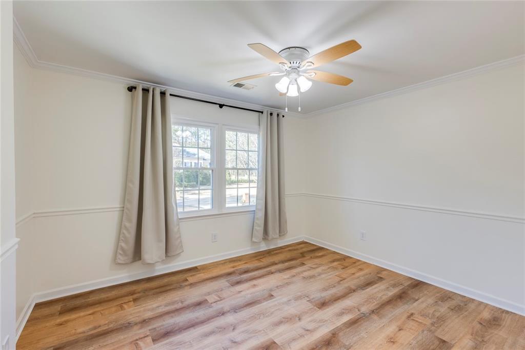 Custom wall molding in this living room/office with French Doors