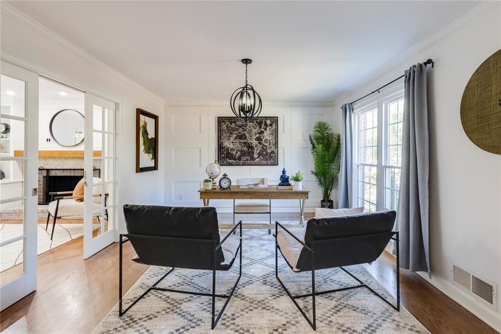 Custom wall molding in this living room/office with French Doors