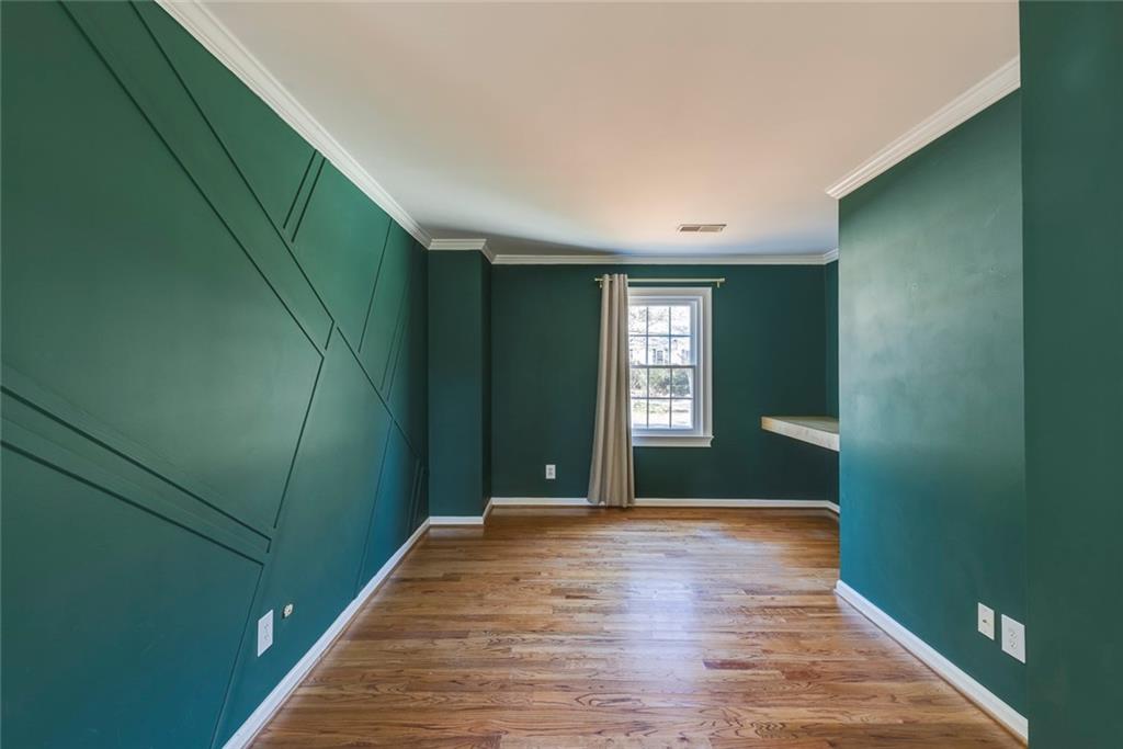Sitting area/office with floating desk in the master