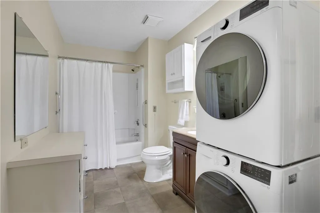 Washer & dryer in the second bathroom for added convenience.