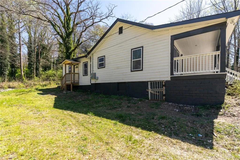 View of home's exterior with a yard