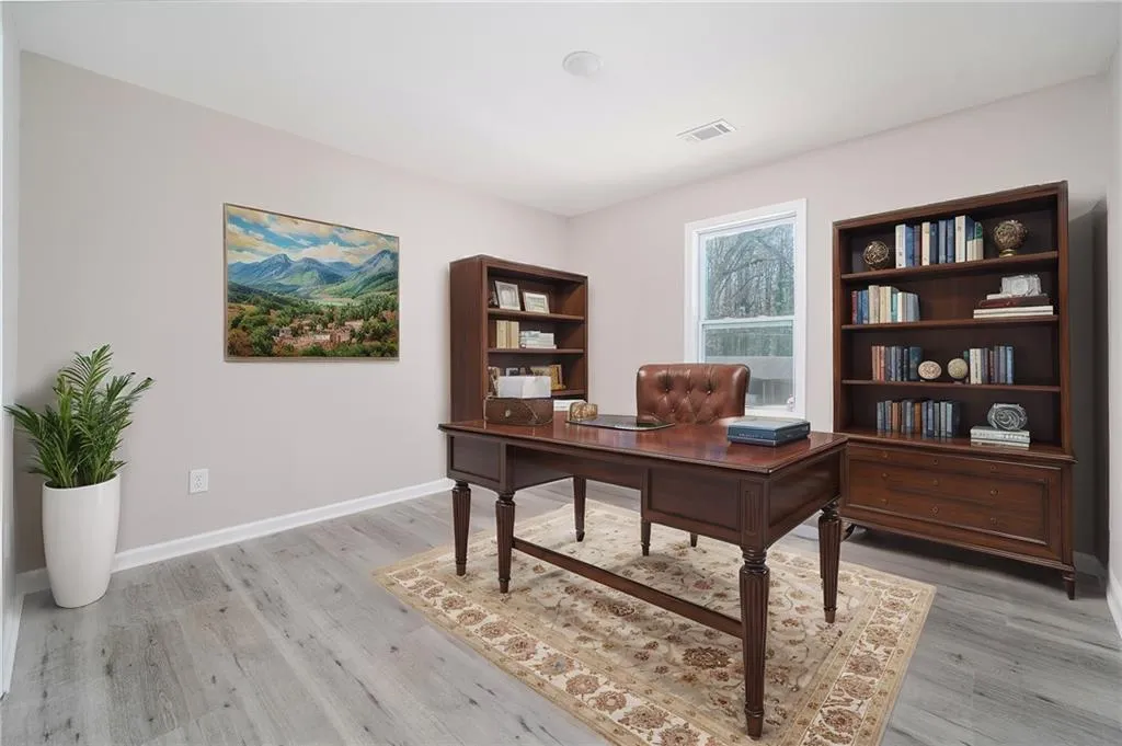 Home office featuring light wood-style flooring