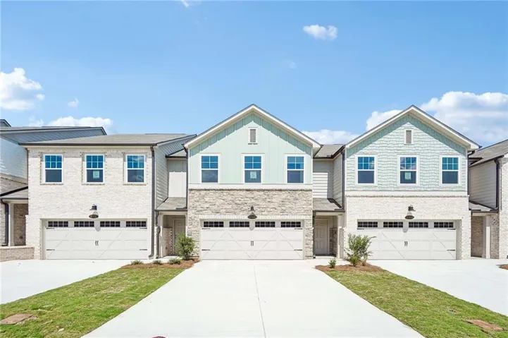 Contemporary townhome **architecture featuring light brick and horizontal siding* Sample Photo*