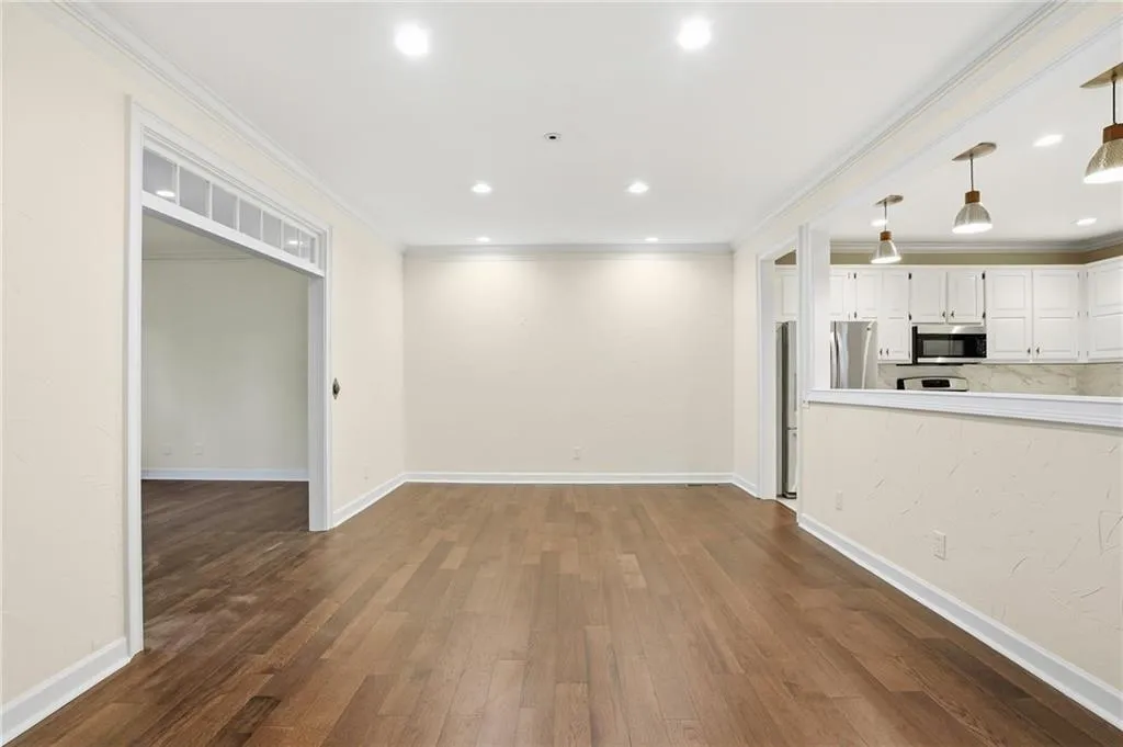 Spacious Dining freshly painted with opening into Kitchen