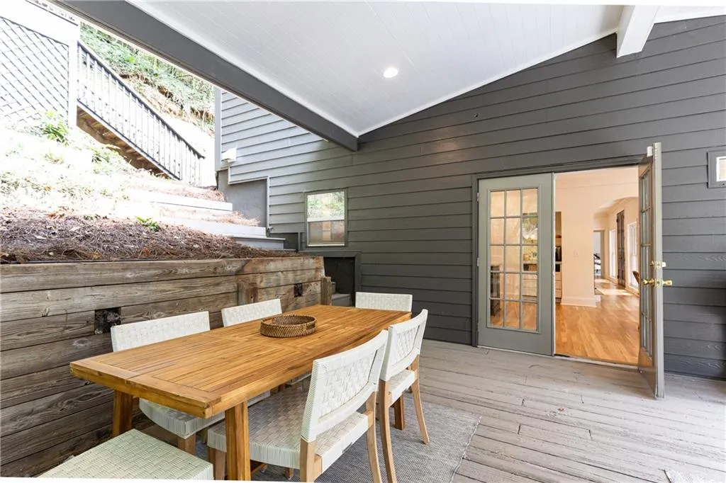 French doors open from kitchen to large covered side porch.. makes for excellent entertaining