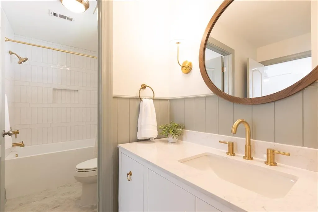 Wood paneling trim details and beautiful neutral tile