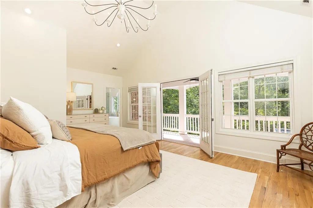 French doors open to its own private porch overlooking the property