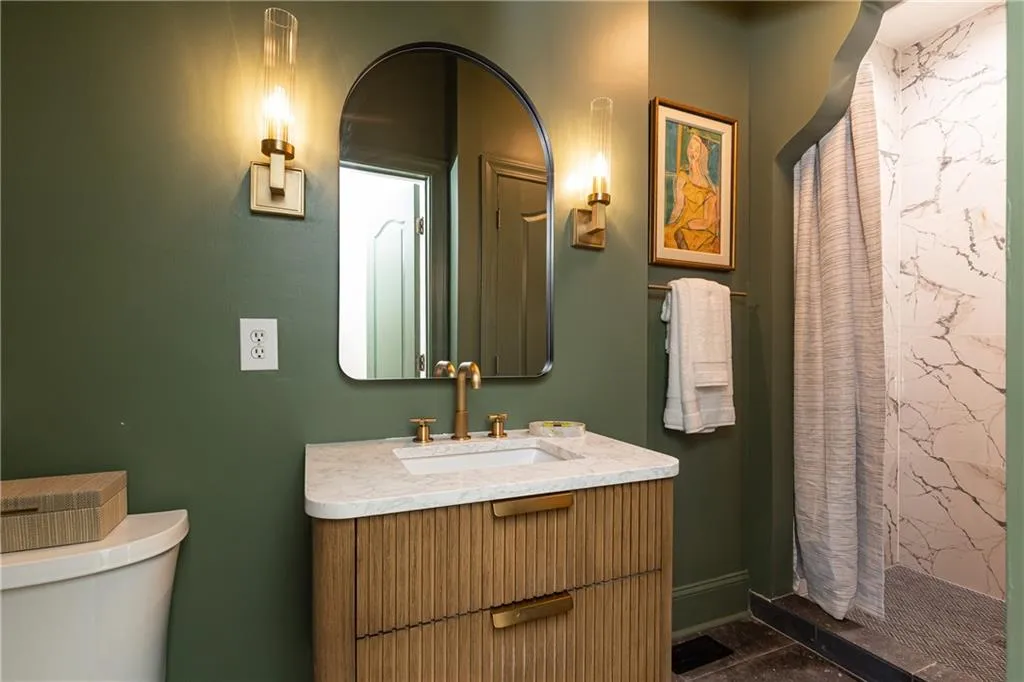 Main level bedroom bath serves as a guest bath also
