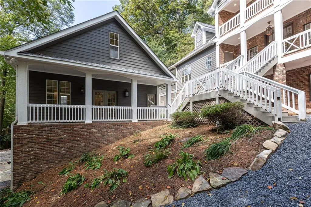 Carriage  house front has full length front porch