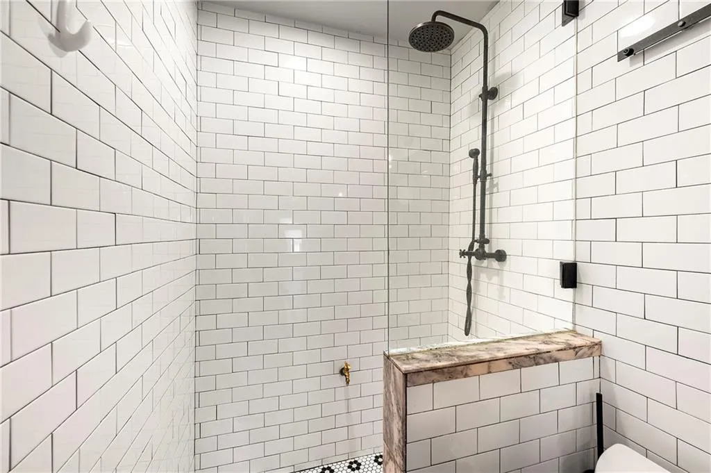 Full bathroom with a tile shower