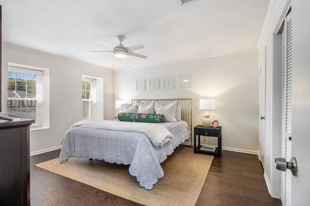 Upstairs, the spacious primary suite offers two closets and a beautifully updated ensuite bath with a stone vanity and shower/tub combo.