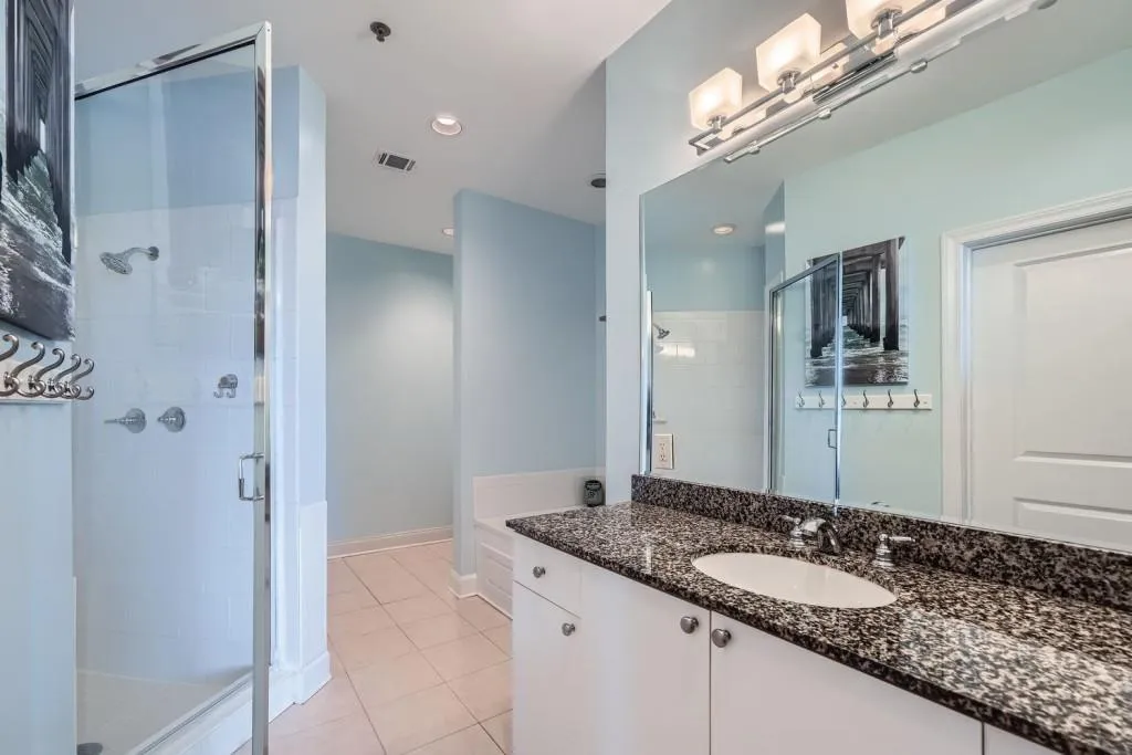 The en suite bath has plenty of counter space and a walk-in closet.